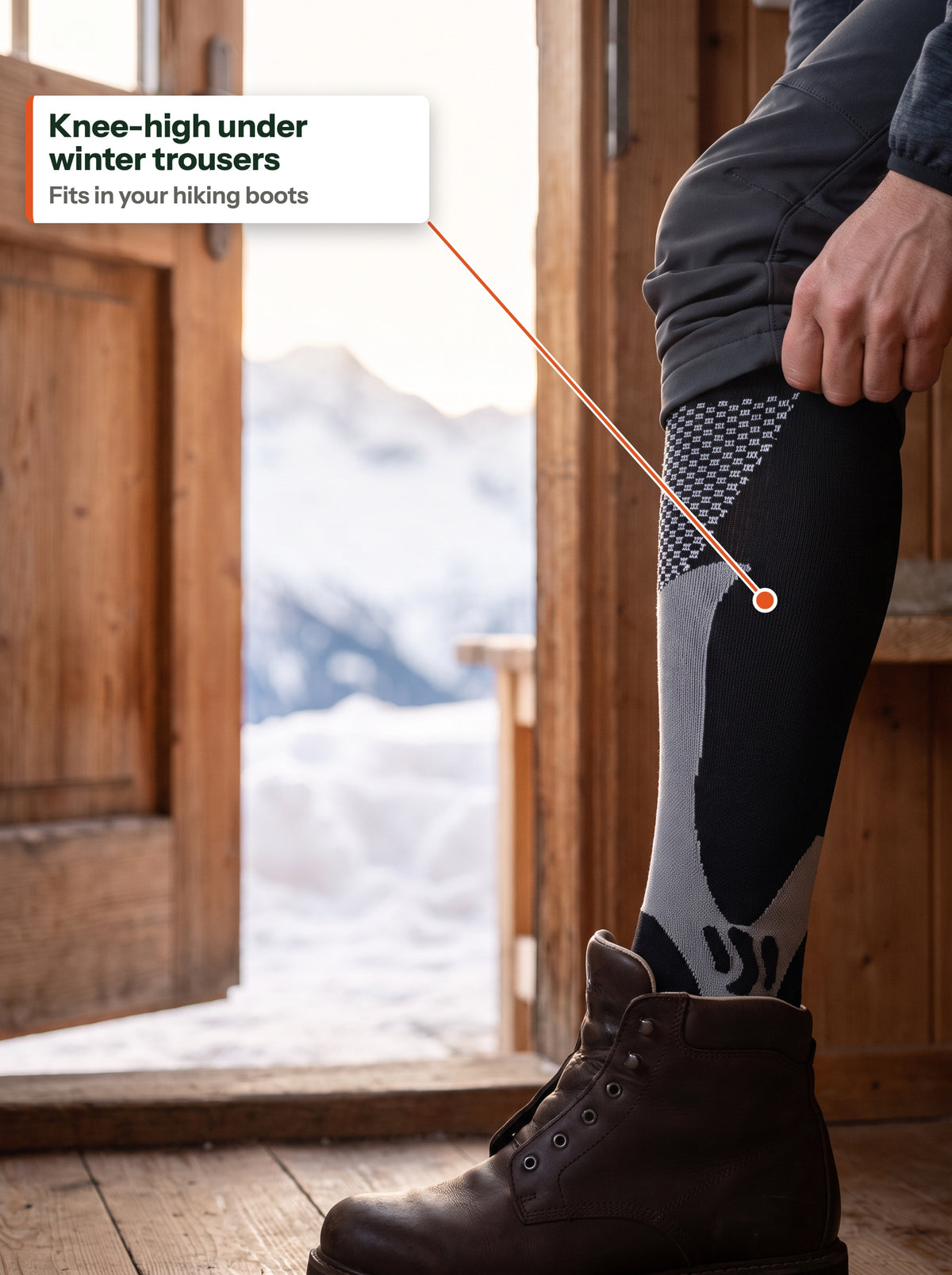 Knee-high compression sock under winter trousers, going into a hiking boot (EN label)