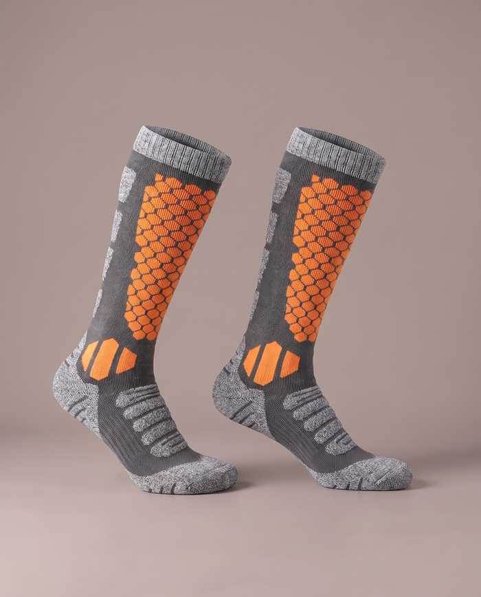 The Knee-High Sock in orange on grey, a pair