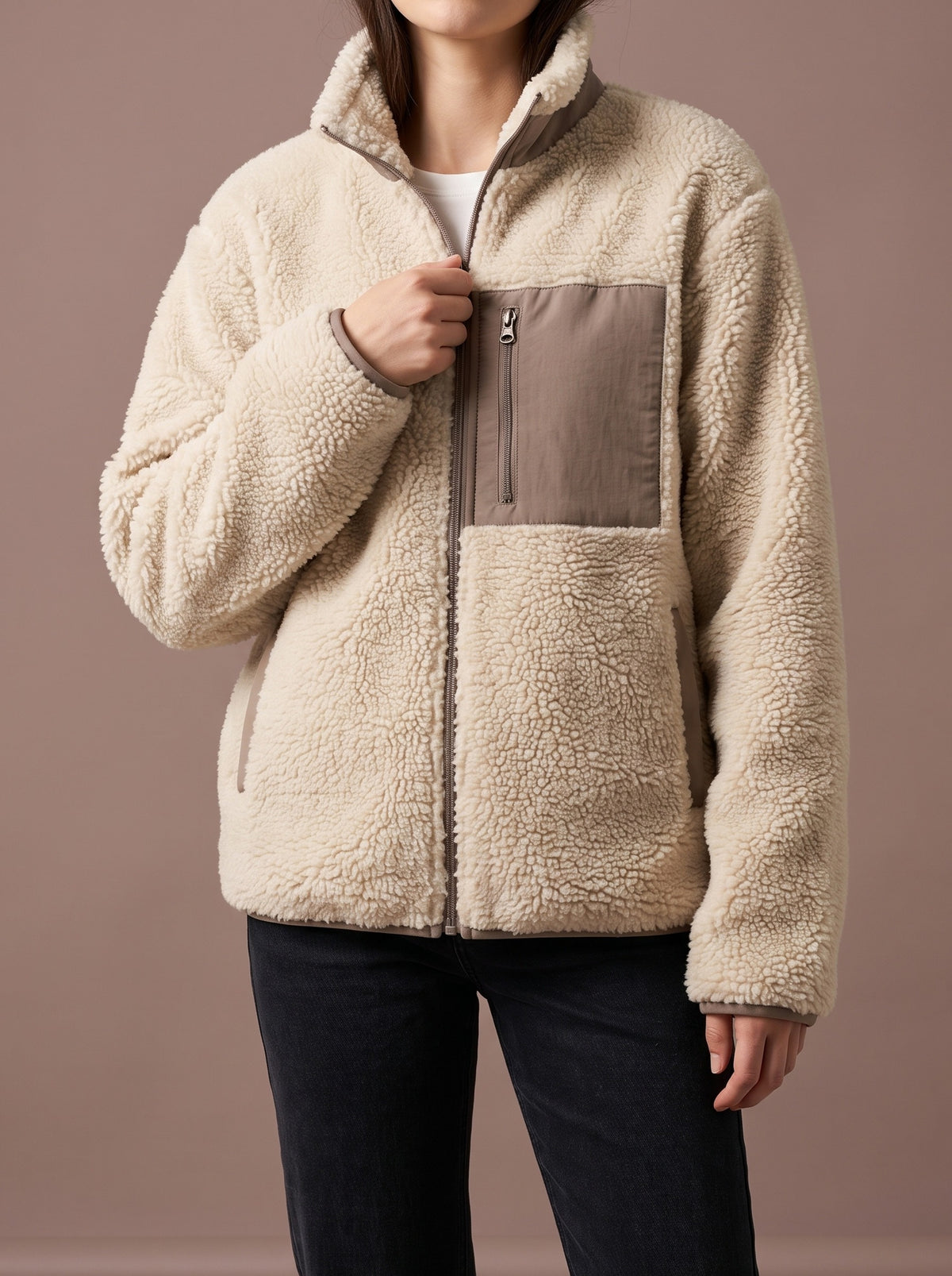 Beige teddy fleece jacket for women with stand collar and taupe woven chest pocket, studio view