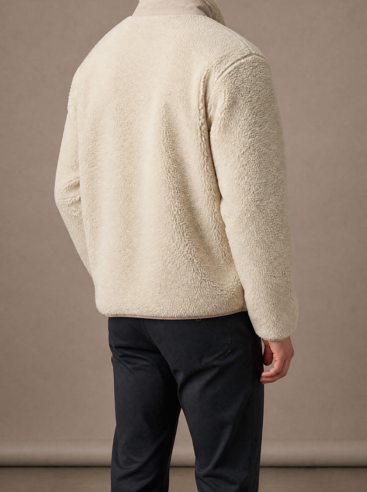 Beige teddy fleece jacket from the back, studio view