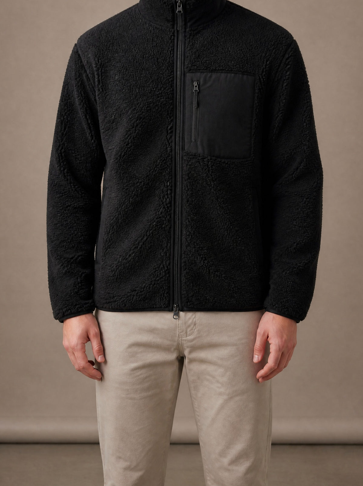 Black teddy fleece jacket for men zipped up, studio view