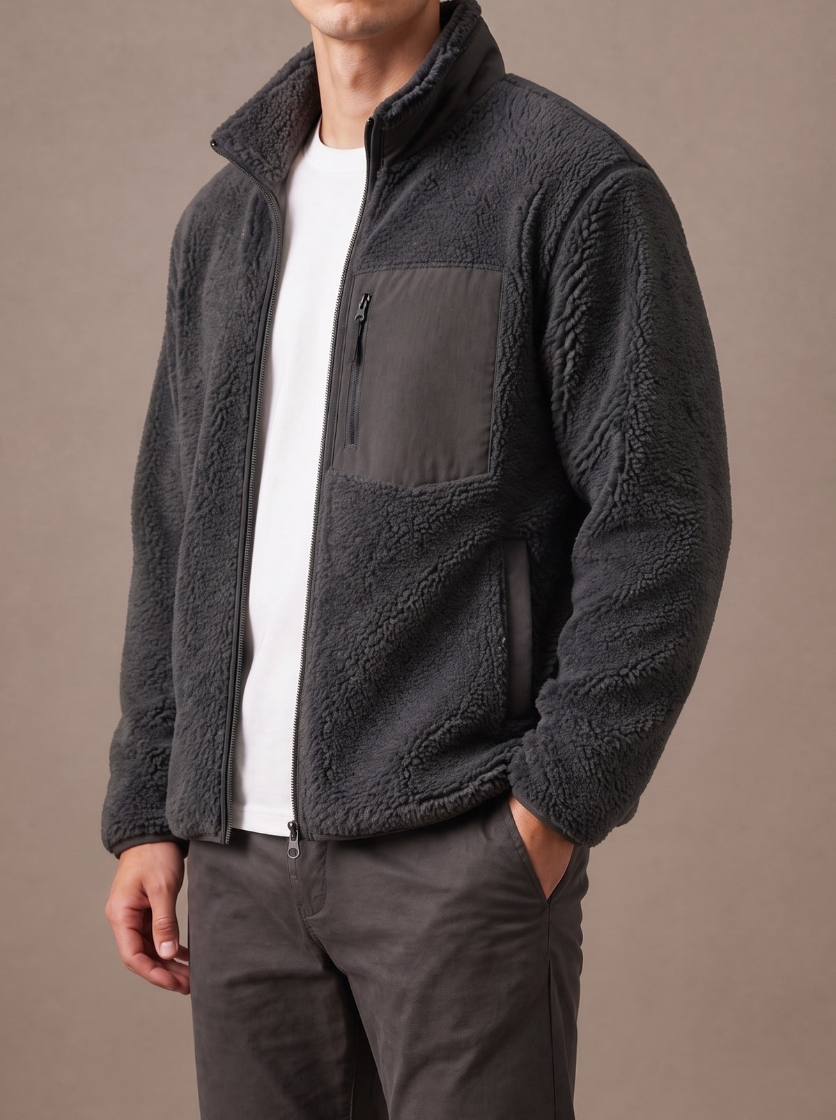 Charcoal grey teddy fleece jacket worn open over a white T-shirt, studio view