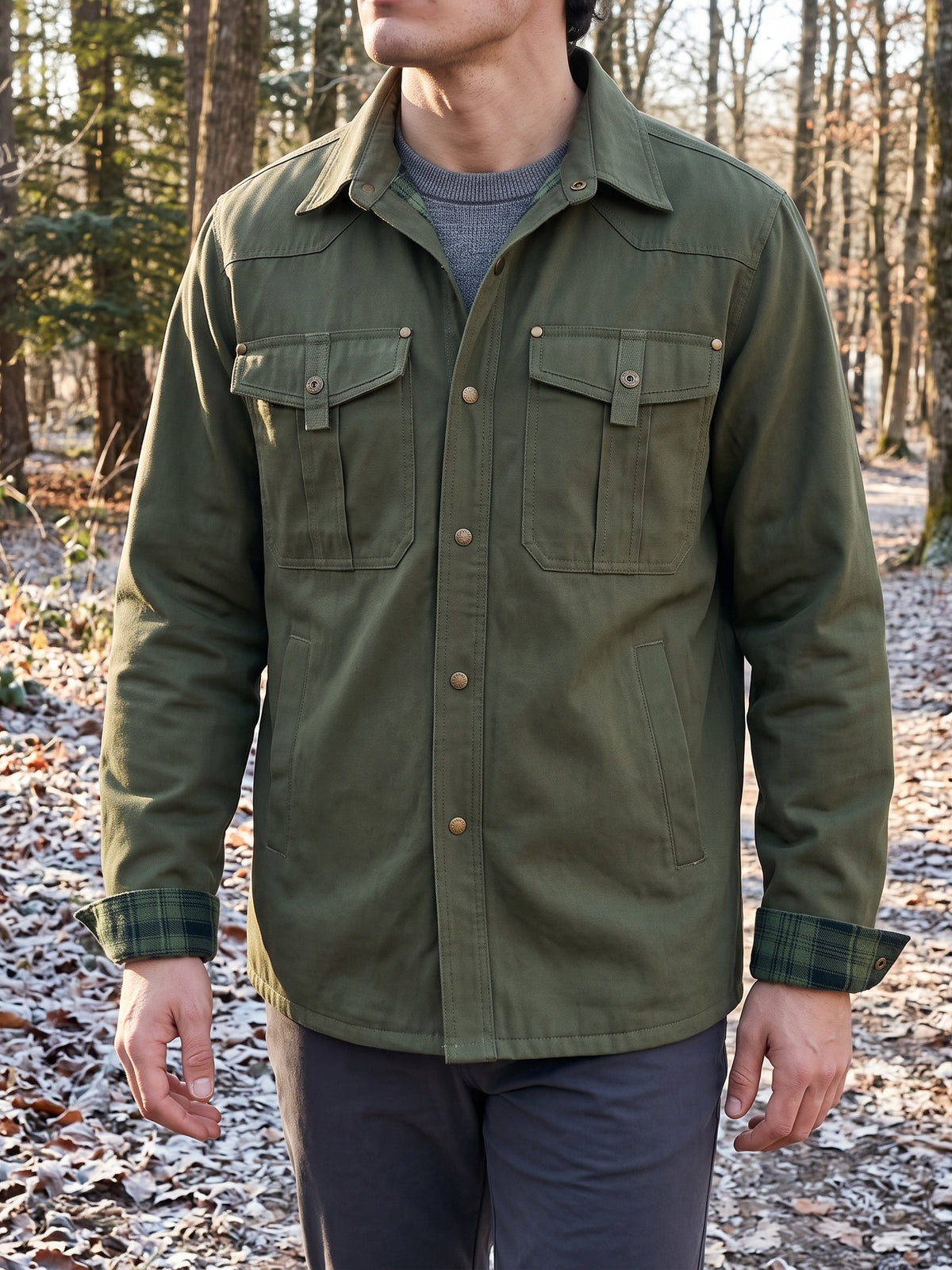Army green flannel-lined shirt jacket worn snapped closed on a frosty woodland path on a bright cold morning