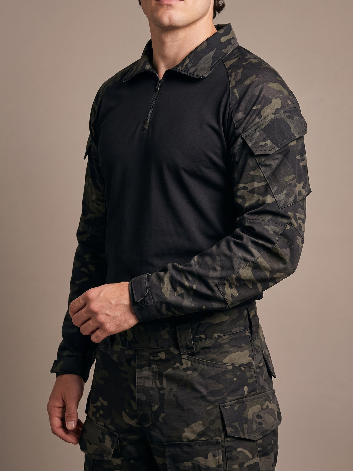 Black Camo combat shirt worn, showing the quarter zip at the camouflage collar and the flap pocket on the camouflage sleeve above the black cuff tab