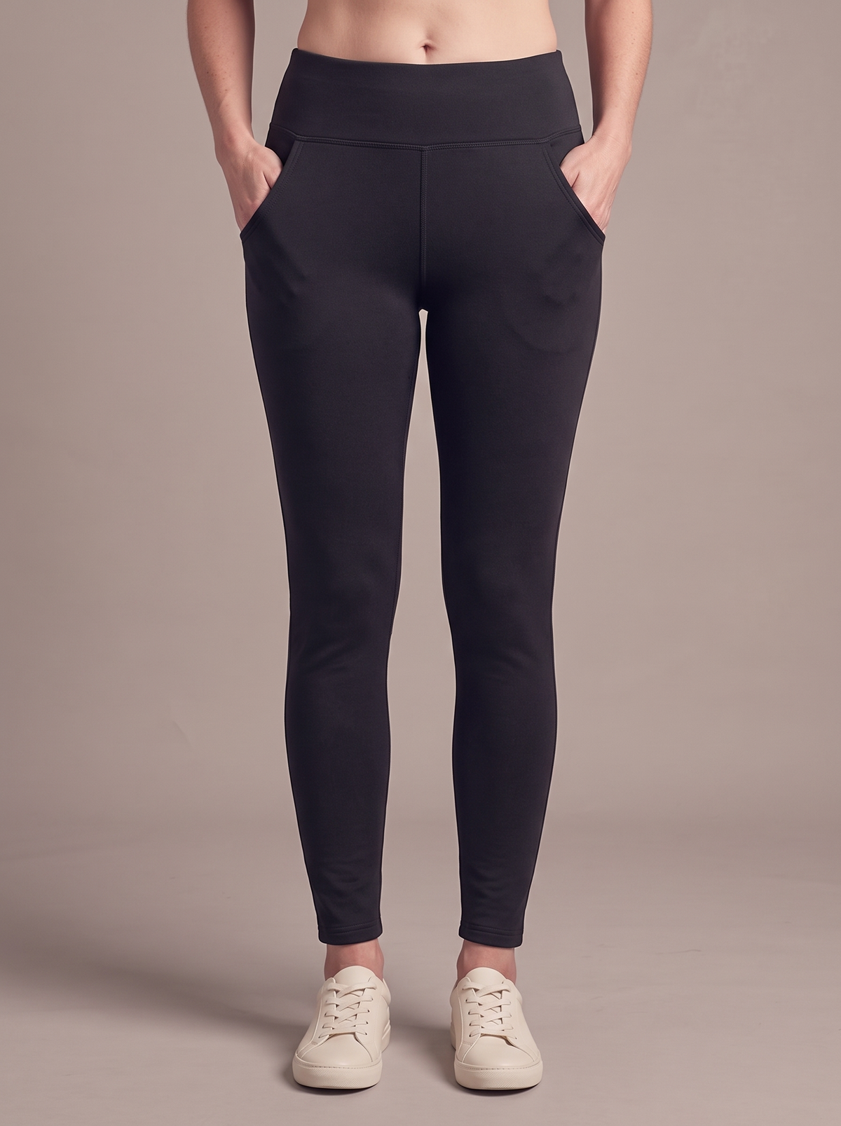 Women's black thermal pocket leggings, studio view