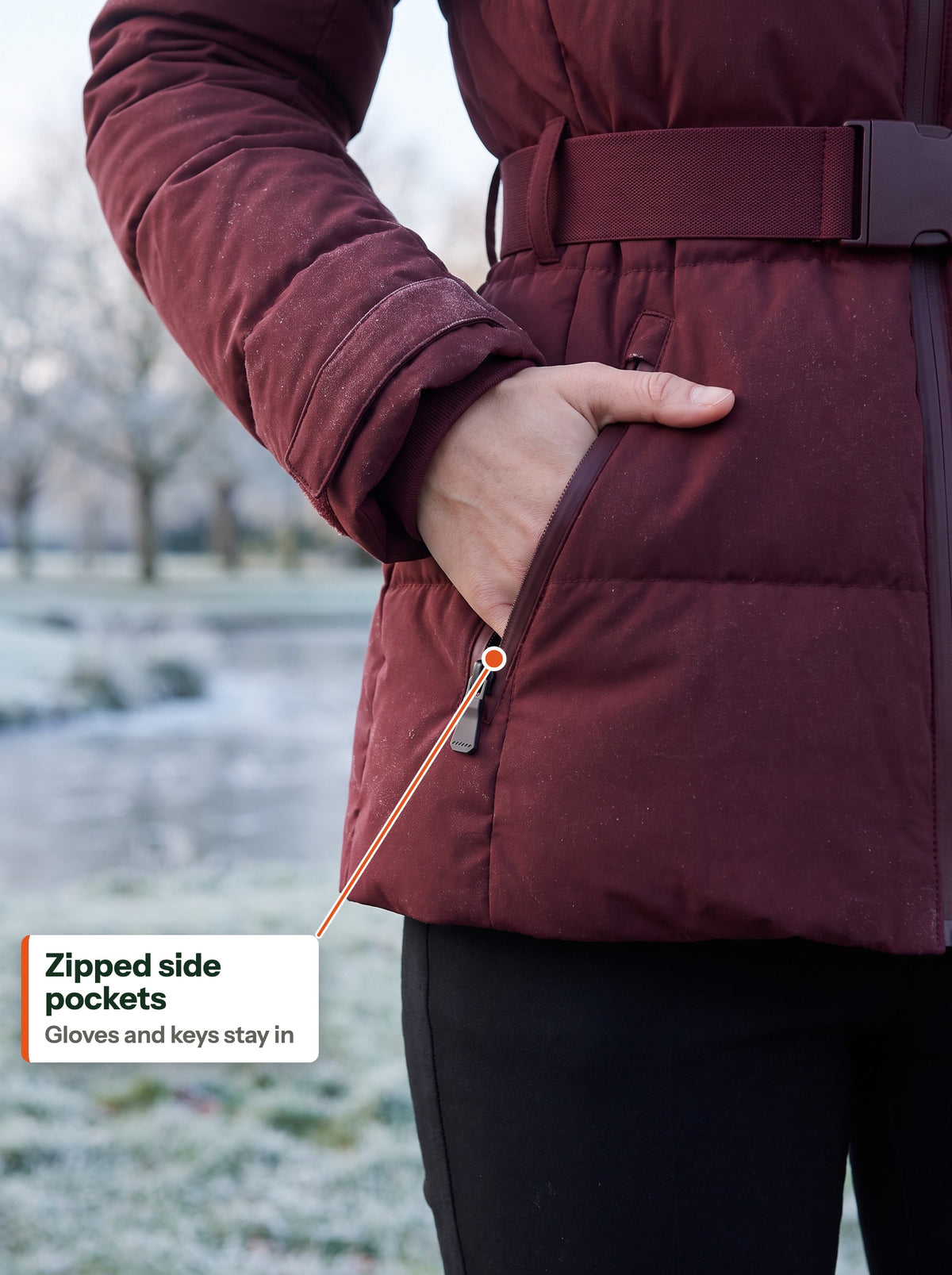 Hand in the zipped side pocket of the burgundy jacket (EN label)