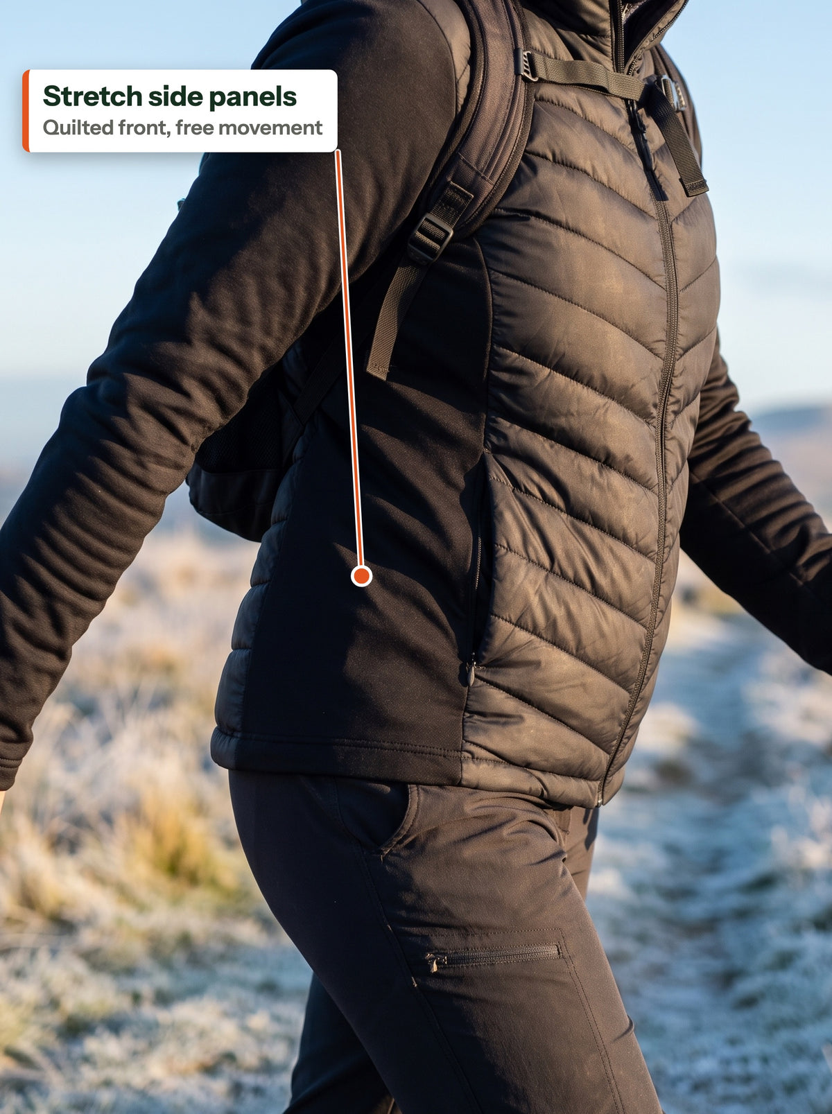 Stretch side panel and chevron-quilted front in motion on a frosty ridge (EN label)
