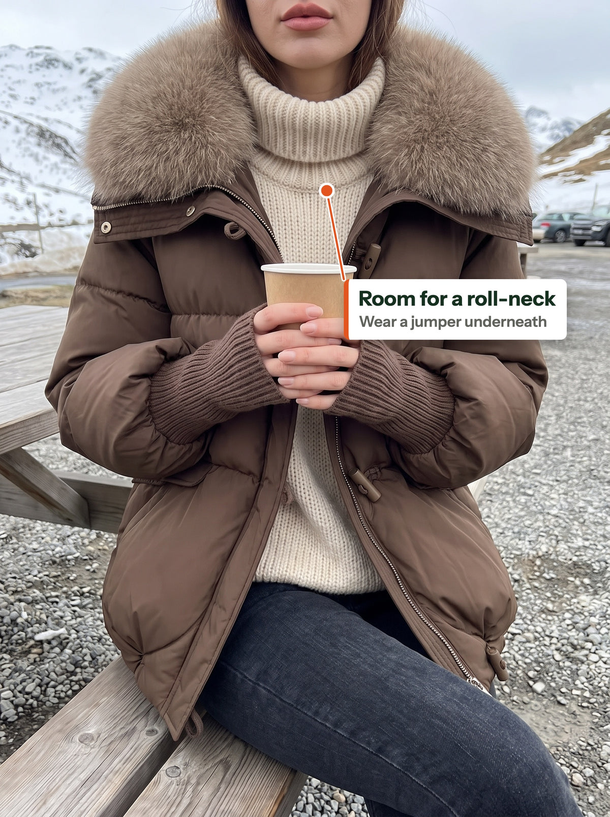 Roll-neck jumper worn under the open jacket at a trailhead cafe (EN label)