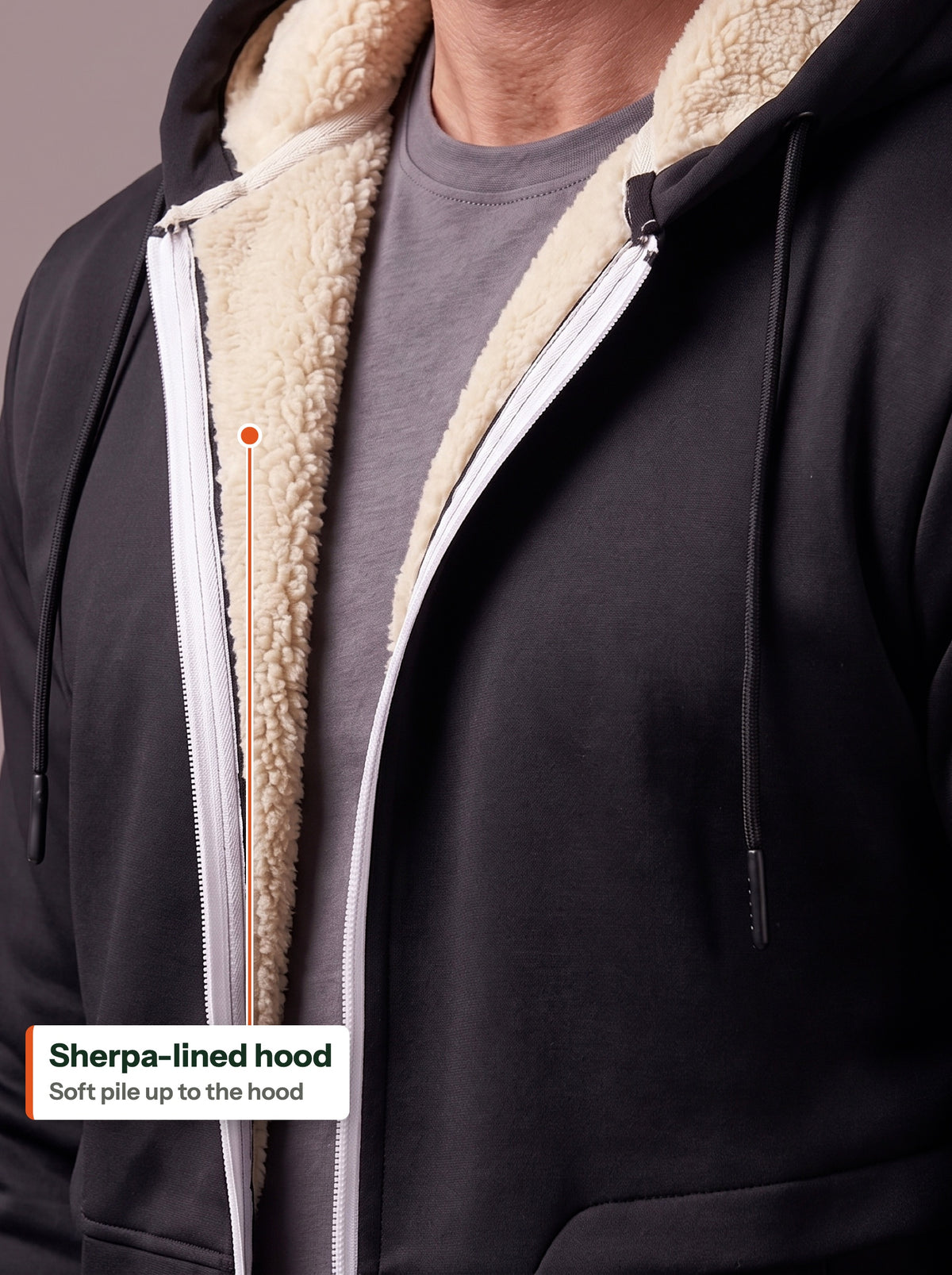 Sherpa-lined hood on the black zip hoodie