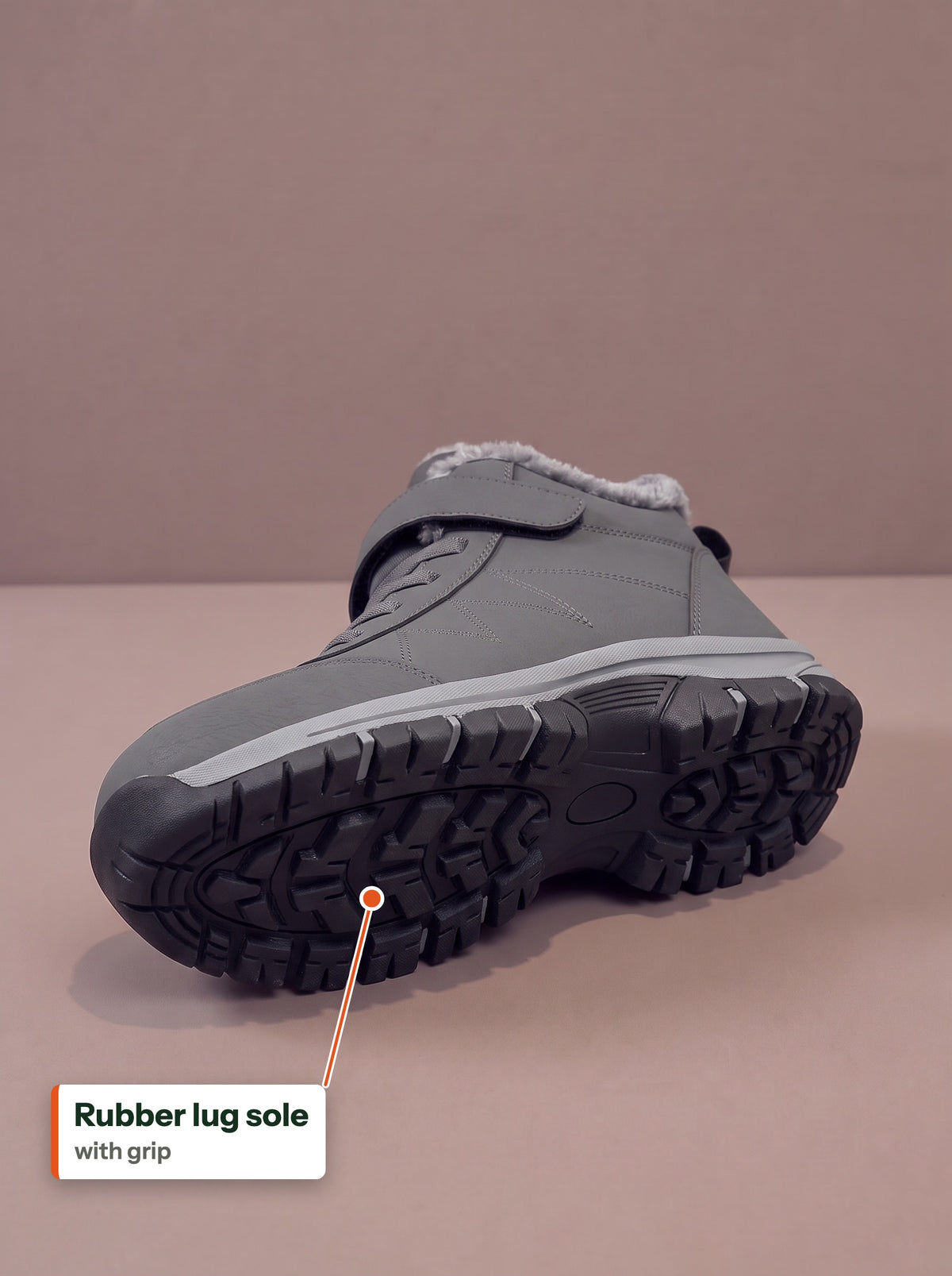Rubber lug sole with grip, underside of the grey Strap Winter Boot