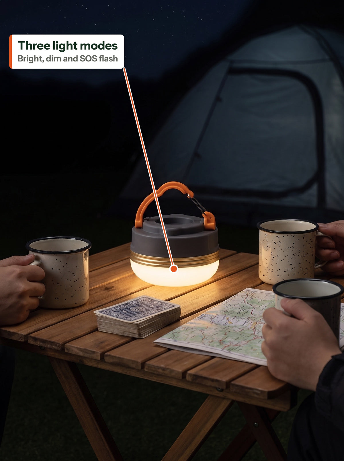 Camp lantern in dim mode on a camp table at night (EN label)