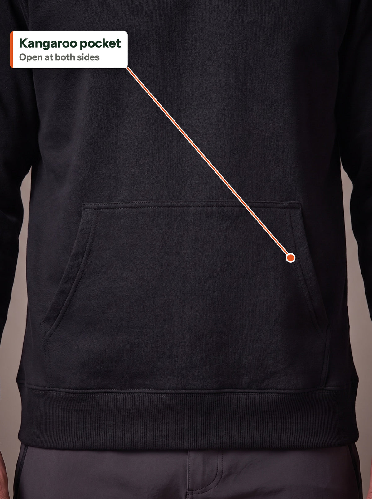 Front of the black Fleece Hoodie showing the kangaroo pocket open at both sides above the ribbed hem