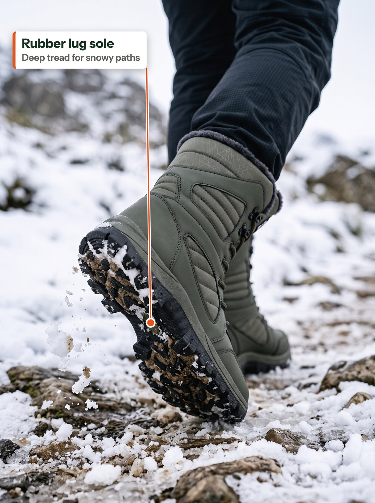 Rubber lug sole of the olive boot on a snowy trail (EN label)