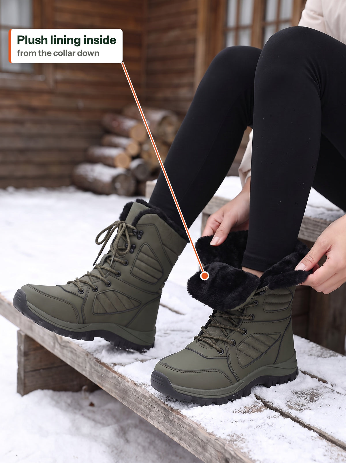 Woman on a snowy cabin step folding back the collar of the olive Trail Snow Boot Women to show the black plush lining (EN label)