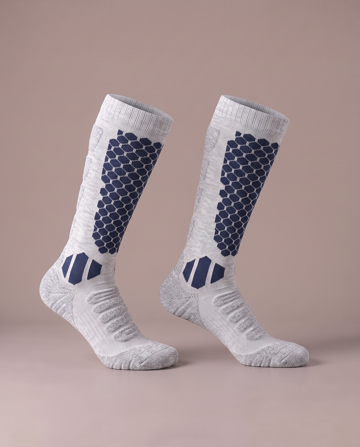The Knee-High Sock in navy on light grey, a pair