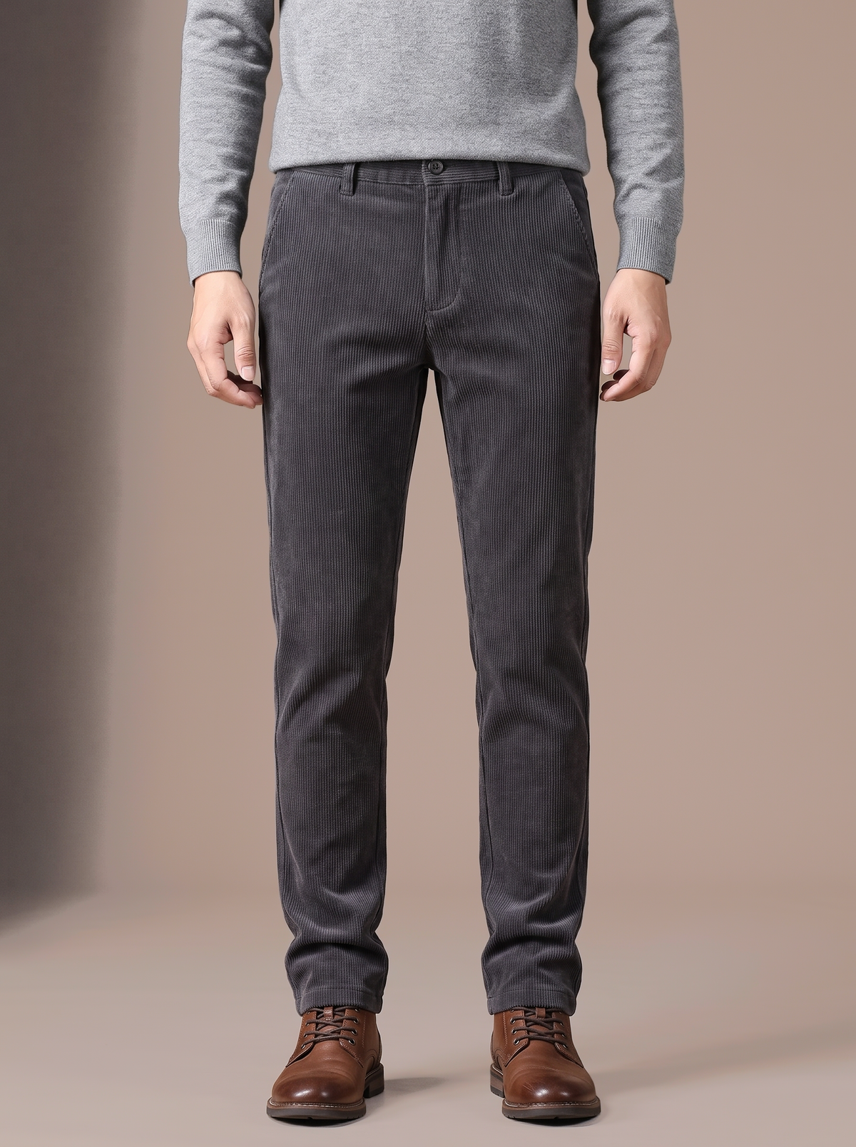 Men's grey plush-lined corduroy trousers, studio view