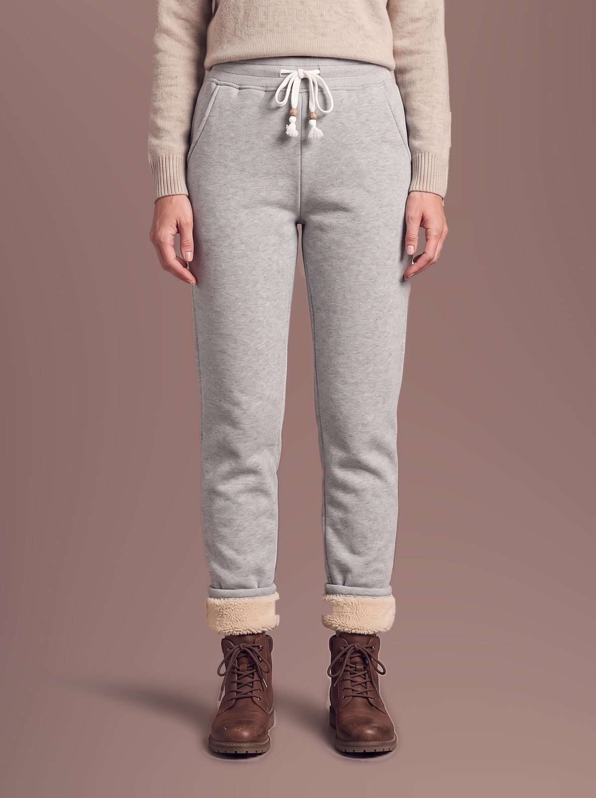 Women's light grey sherpa-lined joggers, studio view