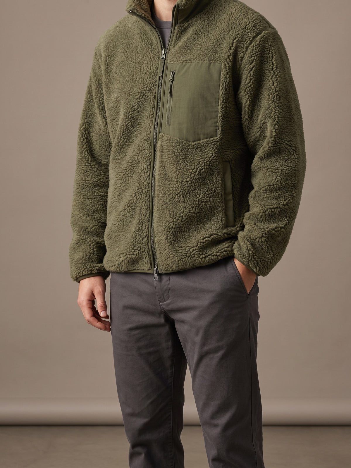 Army green teddy fleece jacket for men with stand collar and woven chest pocket, studio view