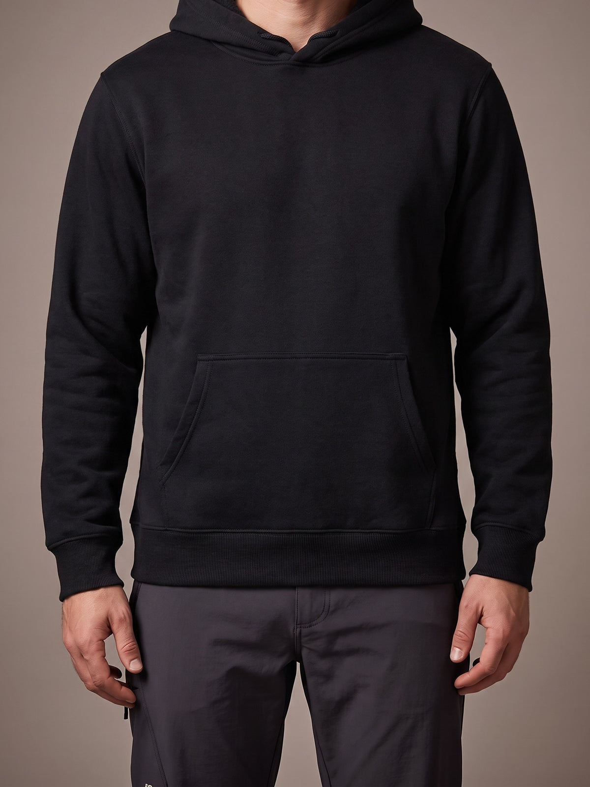 The Fleece Hoodie in black, pullover with hood and kangaroo pocket
