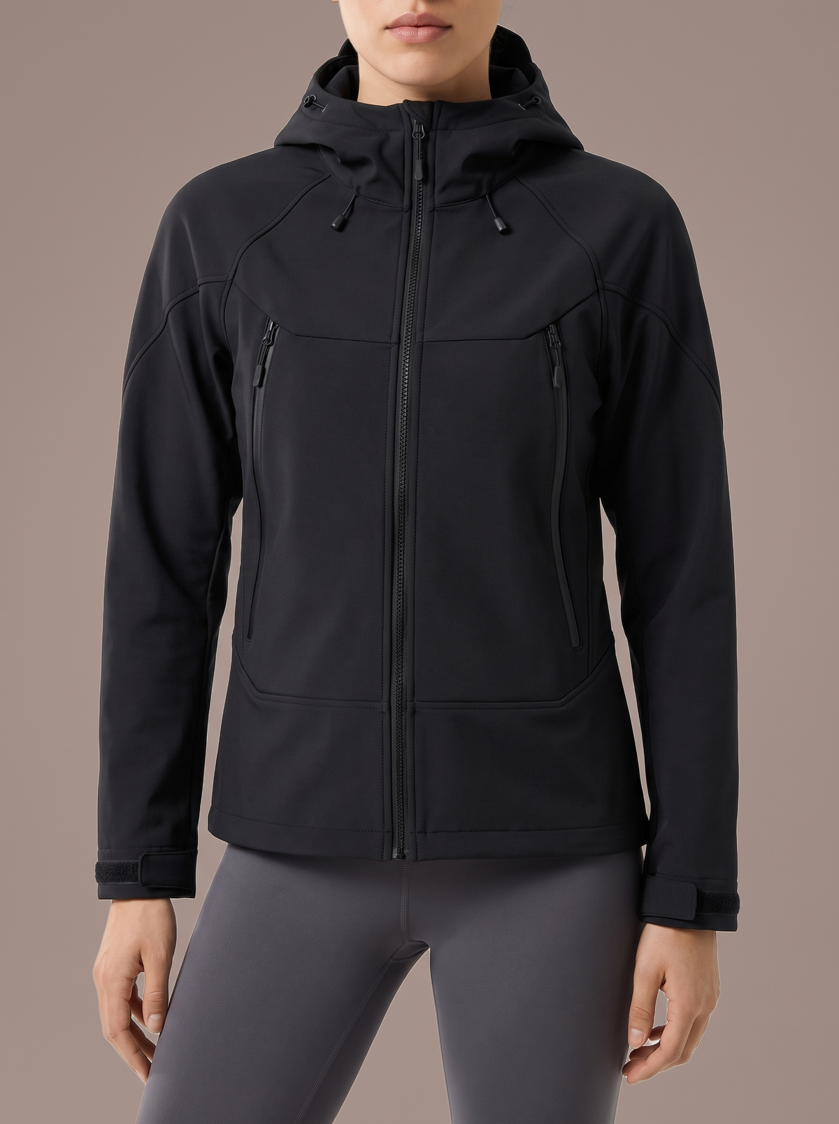 Women's black hooded softshell jacket, studio view