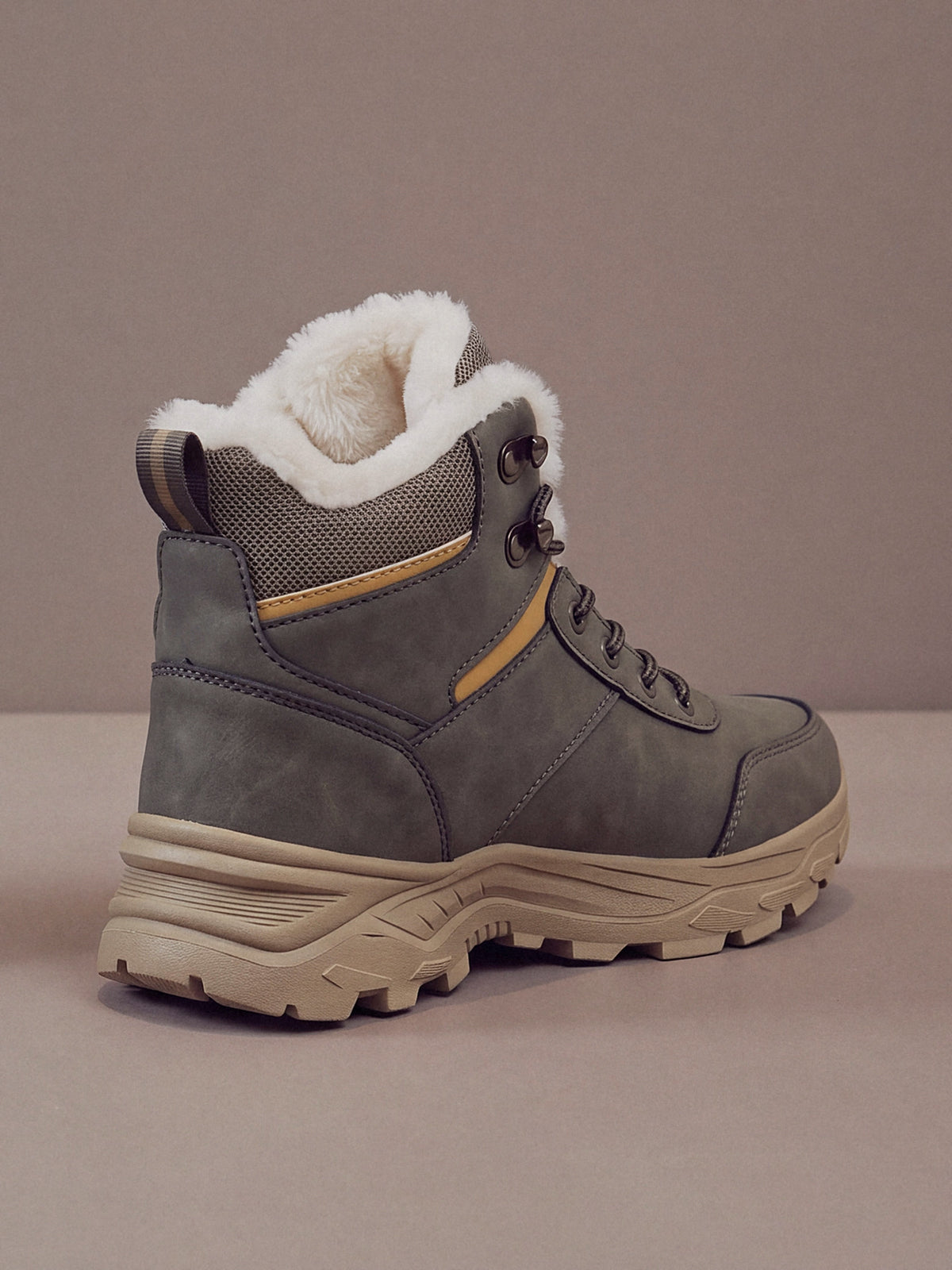 The Winter Trail Boot in grey with a tan sole, studio